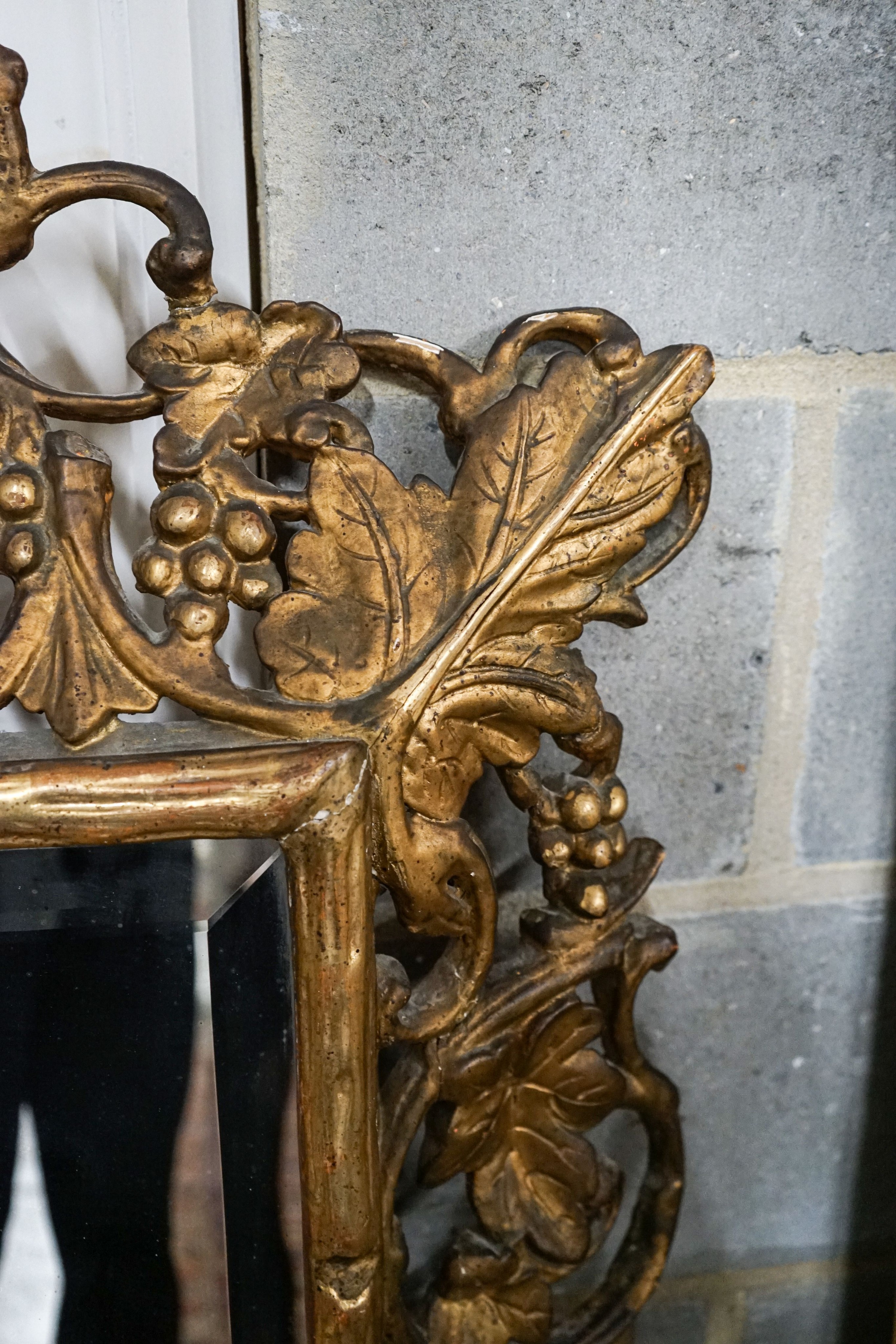 A Victorian carved giltwood and gesso rectangular wall mirror with pierced fruiting vine border, width 98cm, height 148cm